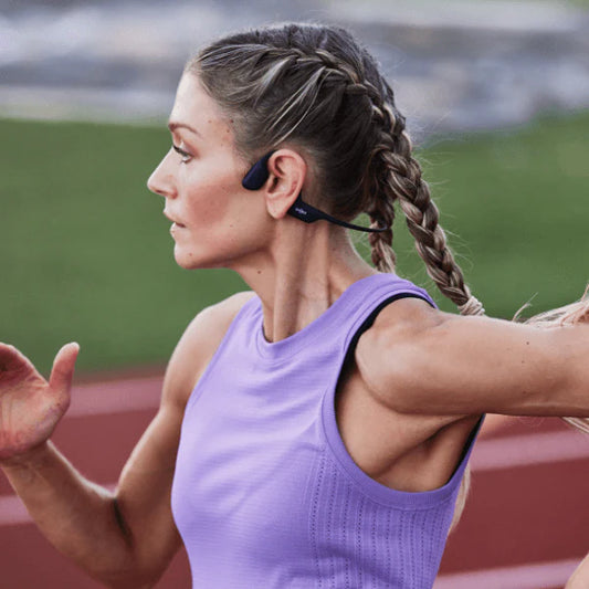 Woman running in SHOKZ headphones